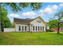 Charming single-story home with a well-manicured lawn and inviting curb appeal at 426 College E St, Bowdon, GA 30108