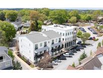 Modern three-story building with balconies, parking, and close proximity to the town square at 160 Fowler St # 100, Woodstock, GA 30188