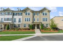 Charming townhome with well-maintained landscaping, beautiful curb appeal, and a welcoming entrance at 4259 Baden Aly, Duluth, GA 30097