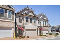 Charming new construction townhomes with brick and siding exterior details at 690 Stickley Oak Way, Woodstock, GA 30189