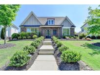 Charming home with landscaped front yard, brick facade, and inviting walkway at 3460 Montebello Pkwy, Cumming, GA 30028