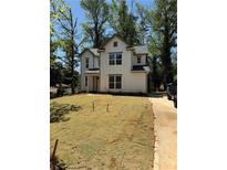 New construction features a charming two-story home with a well-manicured front yard and a classic architectural design at 3089 Corbin Ave, Decatur, GA 30034