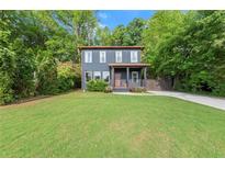 Charming two-story home with a well-manicured lawn and inviting front porch at 479 Clifton Se St, Atlanta, GA 30316