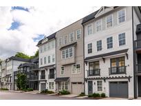 Modern townhome exteriors showcasing neutral color palettes and private garages at 24 Becker Nw Pl, Atlanta, GA 30307