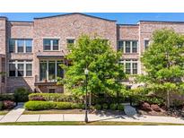 Stunning brick townhome with lush landscaping and charming curb appeal at 57 Weston Dr # 13, Atlanta, GA 30328