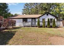 Charming single-story home with a well-maintained lawn, cozy front porch, and fresh exterior paint at 4264 Windward Ln, Norcross, GA 30093