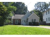 Charming home with a manicured lawn and mature trees at 490 Culberson Sw St, Atlanta, GA 30310
