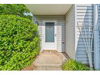 Inviting front entrance with well-kept greenery and neutral colored siding at 3 Fairway Nw Dr, Kennesaw, GA 30144
