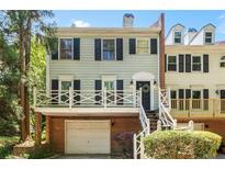 Charming two-story townhome featuring a private balcony, brick facade and garage access in a desirable community at 104 Terrace Ne Dr # 1, Atlanta, GA 30305