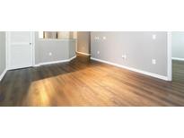 Bright living room with sleek hardwood floors and modern gray walls at 10 Ne Perimeter Summit Ne Blvd # 4428, Brookhaven, GA 30319