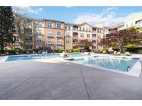 Inviting pool area with lounge chairs, surrounded by a well-maintained apartment complex at 10 Ne Perimeter Summit Ne Blvd # 4428, Brookhaven, GA 30319