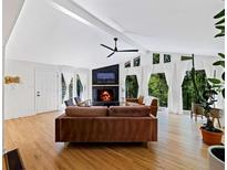Bright living room with vaulted ceilings, fireplace, and hardwood floors at 579 Fielding Ln, Atlanta, GA 30311