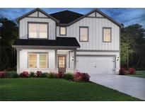 Charming two-story home features a two-car garage, landscaped yard and classic curb appeal at 376 Tallulah Ln, Grayson, GA 30017