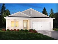 Charming single-story home featuring a brick facade, attached garage, and a well-manicured front lawn at 371 Tallulah Ln, Grayson, GA 30017