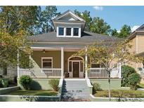 Charming craftsman-style home featuring a covered front porch and a landscaped yard at 501 Dargan Sw Pl, Atlanta, GA 30310