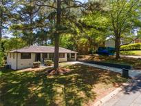 Charming home with landscaped front yard and a long driveway at 2704 Terratim Ln, Decatur, GA 30034