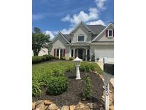 Charming gray two-story home with manicured landscaping and stone accents at 280 Ridge Bluff Ln, Suwanee, GA 30024