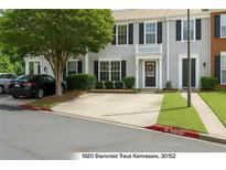Charming townhome featuring a welcoming entrance and convenient parking at 1920 Stancrest Nw Trce, Kennesaw, GA 30152