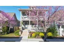Charming two-story home featuring a double porch and beautiful landscaping at 94 Hogue Ne St, Atlanta, GA 30312