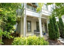 Charming two-story home with a cozy front porch and well-manicured landscaping in a suburban neighborhood at 986 Mauldin Se St, Atlanta, GA 30316