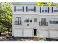 Charming townhome with a three-car garage and classic architectural details at 1150 Collier Nw Rd # 1N, Atlanta, GA 30318