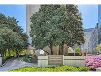 Beautiful apartment building exterior with manicured landscaping and an elegant entrance at 147 15Th Ne St # 16C, Atlanta, GA 30309