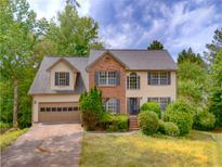 Charming two-story home with a brick facade, well-maintained landscaping, and a two-car garage at 2869 Hickory Run Cir, Duluth, GA 30096