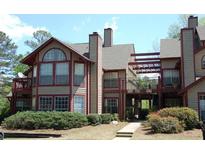 Attractive multi-level condos with green landscaping, balconies, and architectural design at 412 Hawkstone Way, Alpharetta, GA 30022