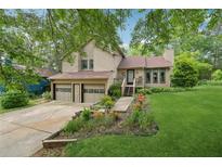 Charming home with a two-car garage, landscaped front yard, and inviting entrance at 1149 Midland Nw Dr, Acworth, GA 30102