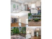 Bright kitchen boasts stainless appliances, white cabinets, granite counters, and recessed lighting at 5873 Trellis Ct, Powder Springs, GA 30127