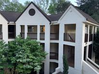 Charming condo exterior with private balconies and lush landscaping at 485 Sherman Way, Decatur, GA 30033