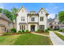 Stunning white brick home with manicured lawn and beautiful landscaping in a desirable neighborhood at 4005 N Stratford Ne Rd, Atlanta, GA 30342