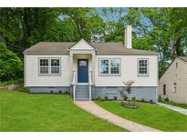 Charming single Gathering home boasting a well-manicured lawn and welcoming entrance at 2590 Eastwood Dr, Decatur, GA 30032