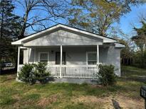 Charming single-story home with a welcoming front porch and fresh gray exterior paint at 753 2Nd St, Stone Mountain, GA 30083