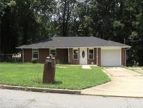 Cozy brick ranch-style home featuring a well-manicured lawn and a classic white front door at 273 Chicamauga Sw Ave, Atlanta, GA 30314