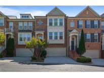 Beautiful brick townhome with attached garages and professionally landscaped front yards at 1530 Wehunt Se Cir # 19, Smyrna, GA 30082