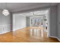 Bright living room features a fireplace, hardwood floors, and large windows at 850 Piedmont Ne Ave # 2509, Atlanta, GA 30308