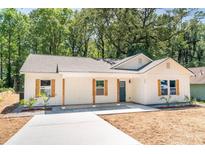Charming, newly renovated home with modern farmhouse style and wooden shutters at 783 Britt Sw Rd, Mableton, GA 30126