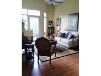 Cozy living room features plush seating, a decorative rug, and a ceiling fan for added comfort at 711 Cosmopolitan Ne Dr # 123, Atlanta, GA 30324