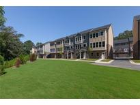 New townhomes with modern exterior design and well-manicured lawn at 3808 Jack Vernon Cir, Powder Springs, GA 30127