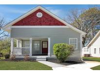 Charming bungalow-style home with red accents and a welcoming front porch at 3087 Semmes St, Atlanta, GA 30344