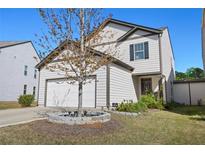 Charming two-story home featuring a two-car garage and a well-manicured lawn at 111 Centennial Ridge Dr, Acworth, GA 30102