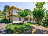 Multi-level home boasts a timeless façade and lush landscaping, creating inviting curb appeal at 101 Ardmore Nw Pl # 3, Atlanta, GA 30309