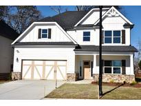 Charming two-story home features a two-car garage, stone accents, and well-maintained landscaping at 505 Brown Dove Ln, Grayson, GA 30017