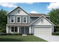 Charming two-story home featuring light blue siding, white trim, and a well-manicured lawn at 72 Warrior Ct, Braselton, GA 30548