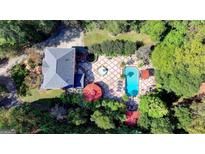 Stunning aerial view of backyard pool, patio, fountains, and lush greenery at 2230 Cammie Wages Rd, Dacula, GA 30019