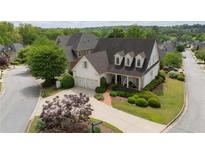 Charming home with a manicured lawn, mature trees, and a two-car garage, creating inviting curb appeal at 1021 Bluffhaven Ne Way, Atlanta, GA 30319