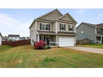 Charming two-story home with manicured lawn and inviting curb appeal in a Gathering-friendly neighborhood at 59 Summer Nw Pl, Cartersville, GA 30121