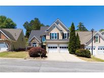 Charming home with a two-car garage and manicured landscaping at 2103 Drogheda Ln, Marietta, GA 30066