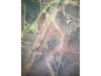 An aerial view of the parcel boundaries reveals a treed landscape, alongside a nearby highway at 5900 N Helton Rd, Villa Rica, GA 30180